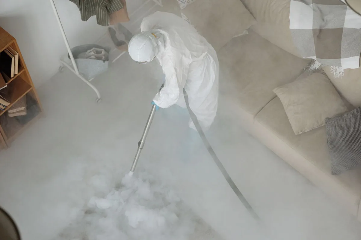 Biohazard cleanup technician in protective equipment, Medfield, MA